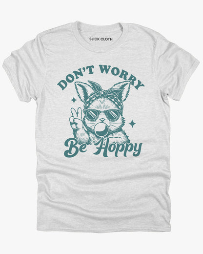Flat lay ash-colored 'Don't Worry, Be Hoppy' shirt featuring a funny retro easter bunny graphic.