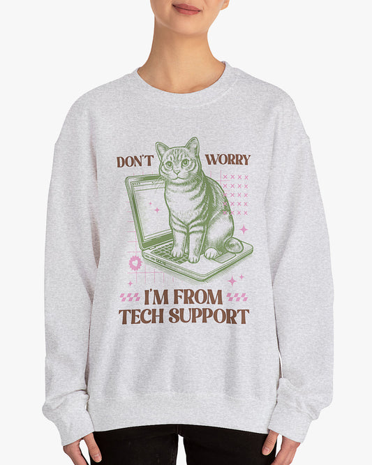 Woman wearing ash gray 'Don't Worry I'm From Tech Support' sweatshirt with funny retro cat sitting computer graphic