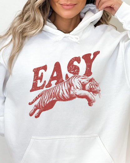 Close-up of a white-colored 'Easy Tiger' hoodie featuring a vintage-style jumping tiger graphic.