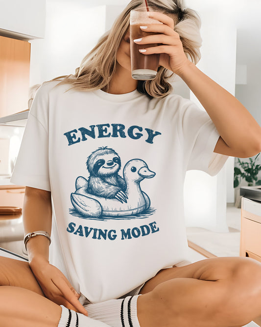 Model wearing white color shirt with 'Energy Saving Mode' funny sloth graphic design