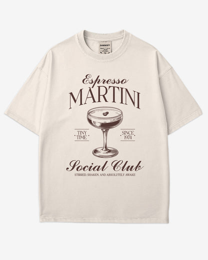 Flat lay ivory 'Espresso Martini Social Club – Stirred, Shaken, and Awake' shirt with a retro graphic of an espresso martini glass.