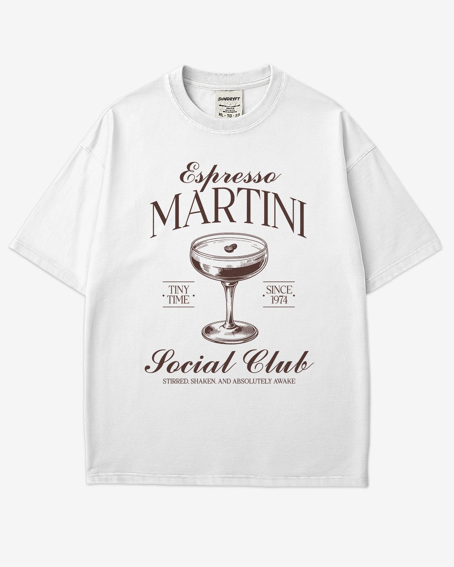 Flat lay white 'Espresso Martini Social Club – Stirred, Shaken, and Awake' shirt with a retro graphic of an espresso martini glass.