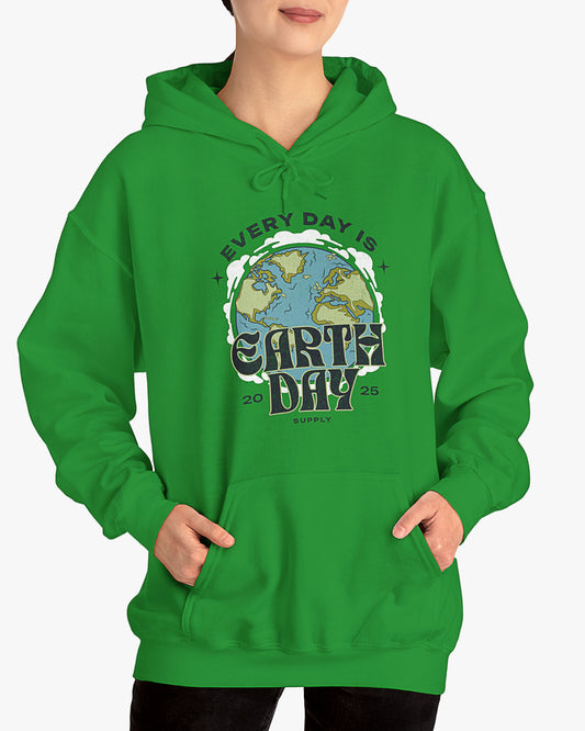 Woman wearing irish green 'Every Day Is Earth Day 2025' hoodie with retro earth globe graphic