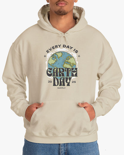 Man wearing sand beige 'Every Day Is Earth Day 2025' hoodie with retro earth globe graphic