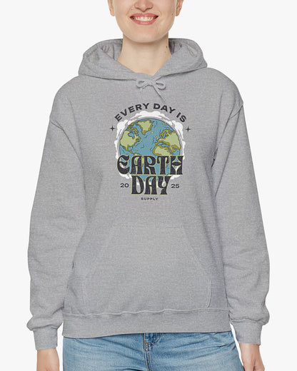 Woman wearing sport gray 'Every Day Is Earth Day 2025' hoodie with retro earth globe graphic