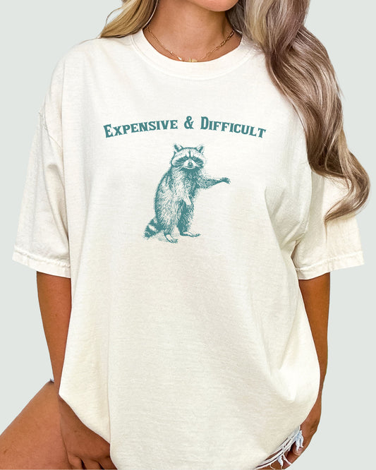 Expensive And Difficult Shirt beige color with funny retro raccoon graphic