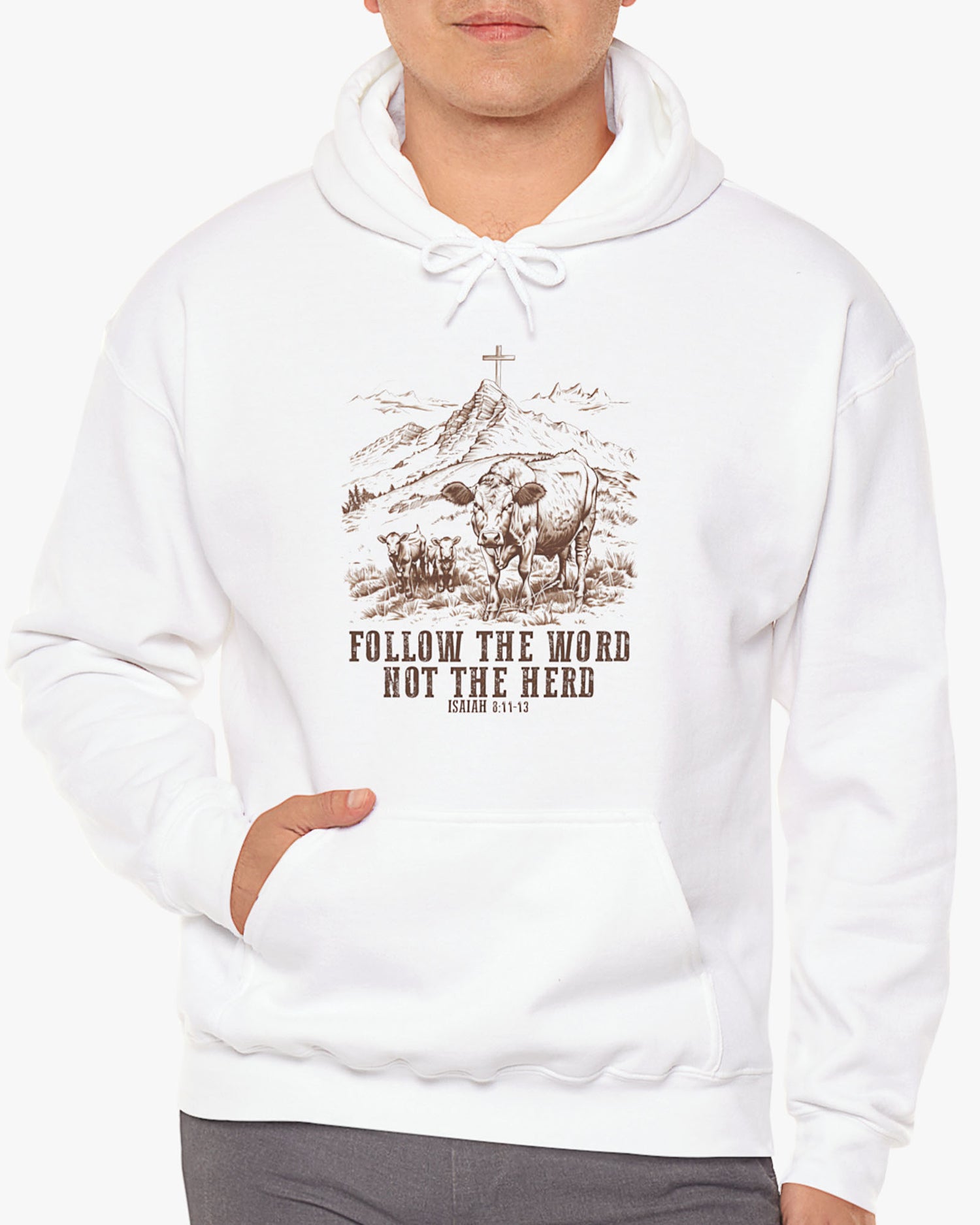 Man wearing a white 'Follow The Word Not The Herd' hoodie with retro cows and meadow graphic