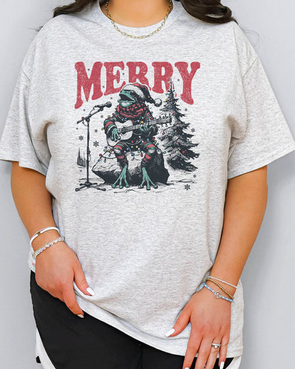 Woman wearing retro Christmas graphic shirt with a funny singing frog graphic