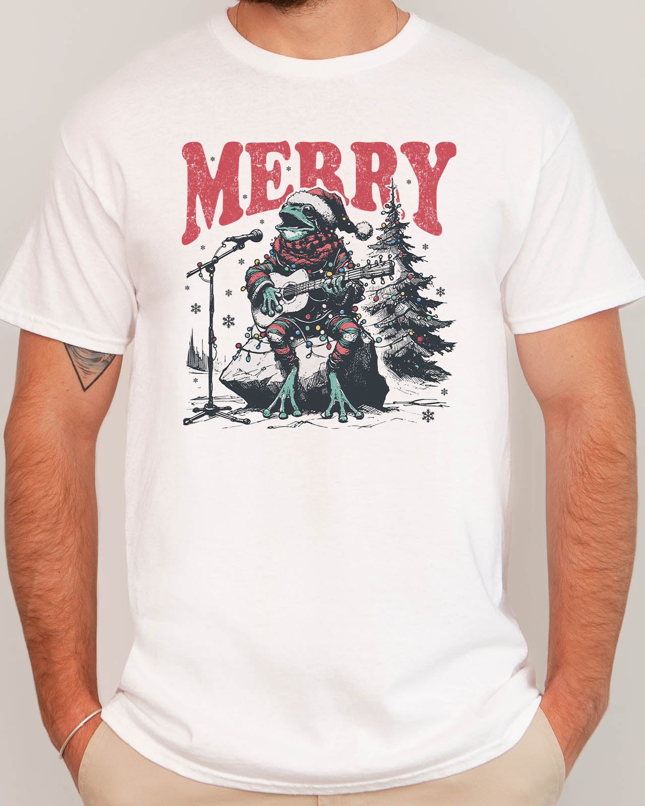 Man wearing retro Christmas graphic shirt with a funny singing frog graphic