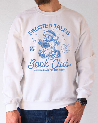 Model wearing white color sweatshirt with 'Frosted Tales Book Club' graphic design