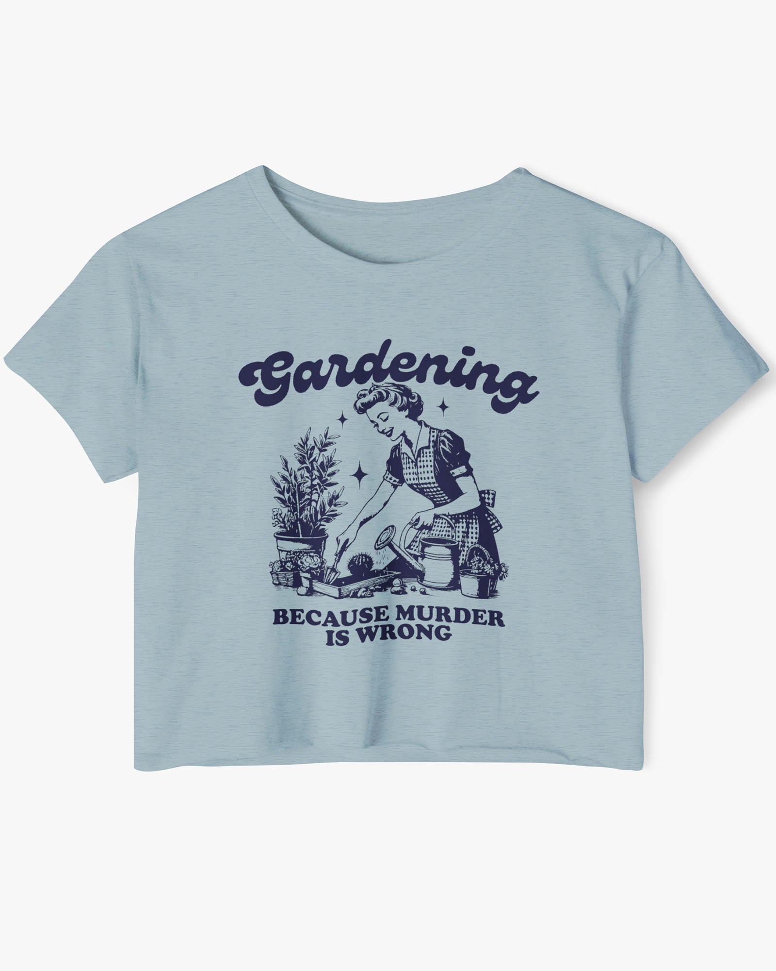 Flat-lay of a stonewash denim crop top featuring a funny retro-style graphic of a housewife gardening with the text ‘Gardening, Because Murder Is Wrong’.