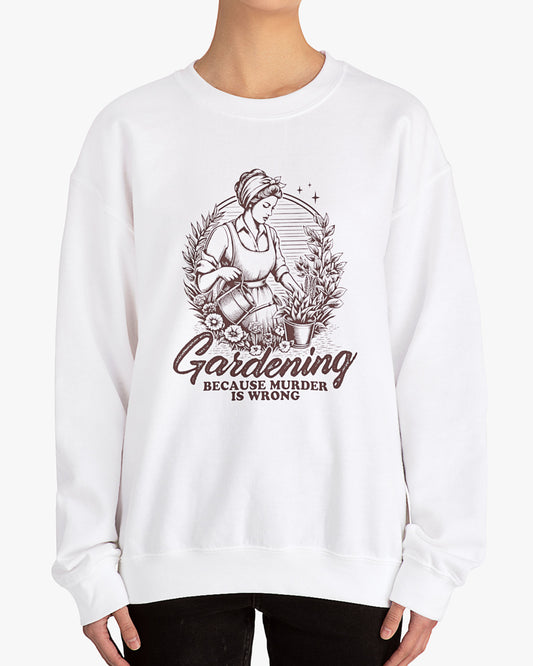 Woman wearing white 'Gardening Because Murder Is Wrong' Graphic Sweater
