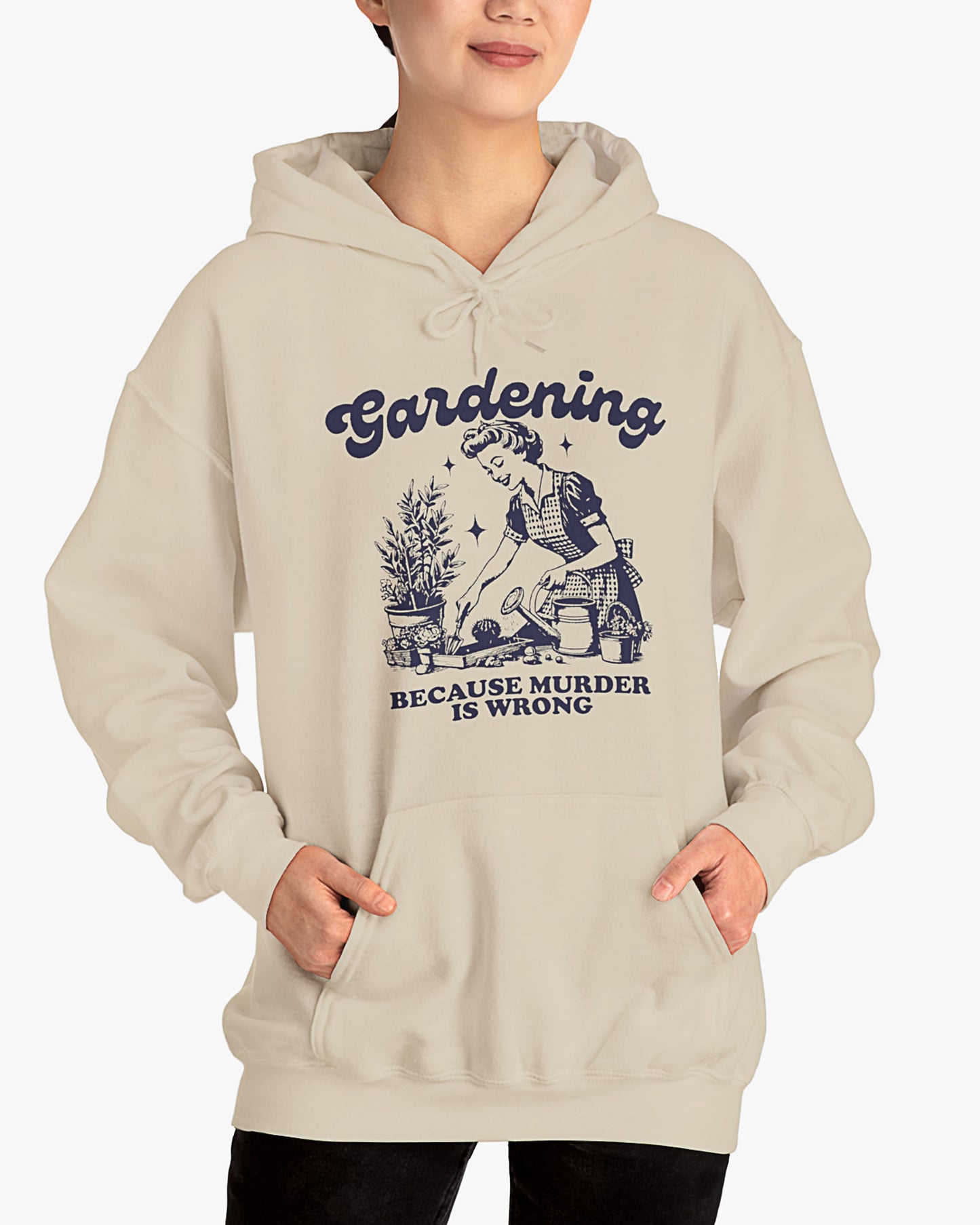 Woman wearing sand beige 'Gardening Because Murder Is Wrong' hoodie