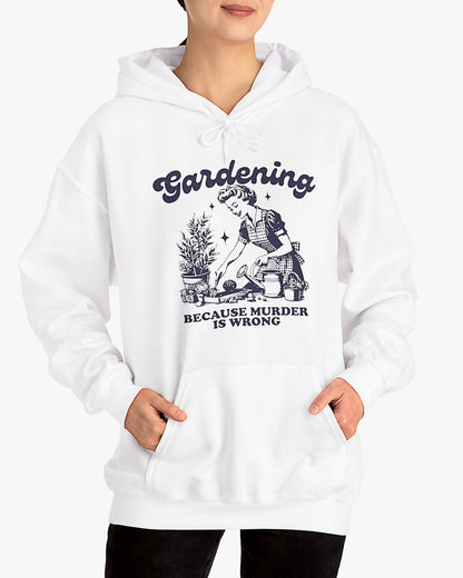 Woman wearing white 'Gardening Because Murder Is Wrong' hoodie
