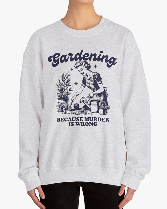 Woman wearing ash gray 'Gardening Because Murder Is Wrong' Sweatshirt