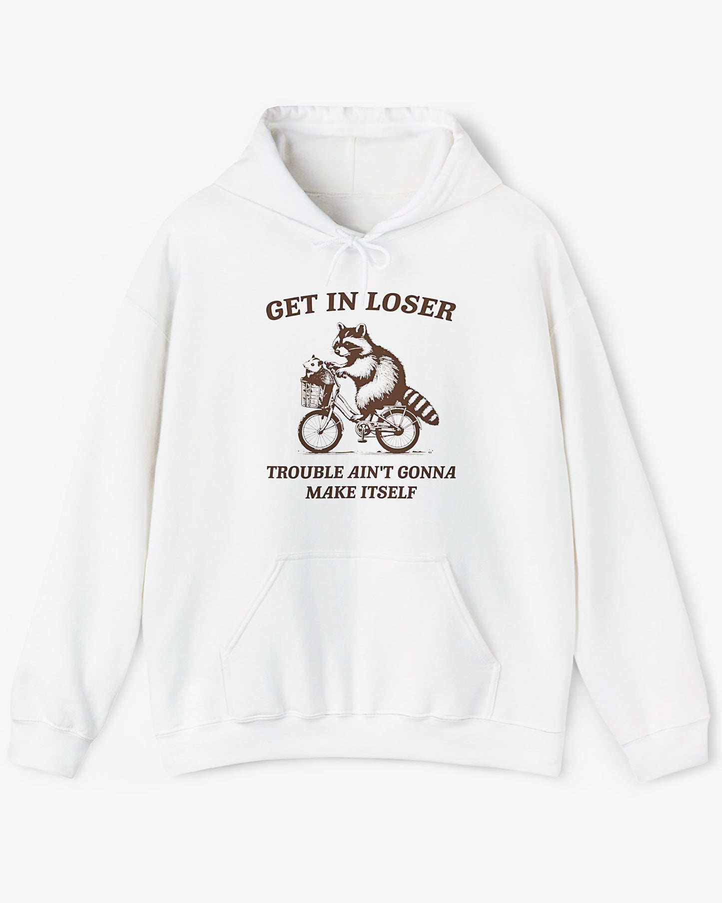 Flat lay white color hoodie with the quote 'Get In Loser, Trouble Ain't Gonna Make Itself' and a funny retro raccoon riding a bycicle graphic