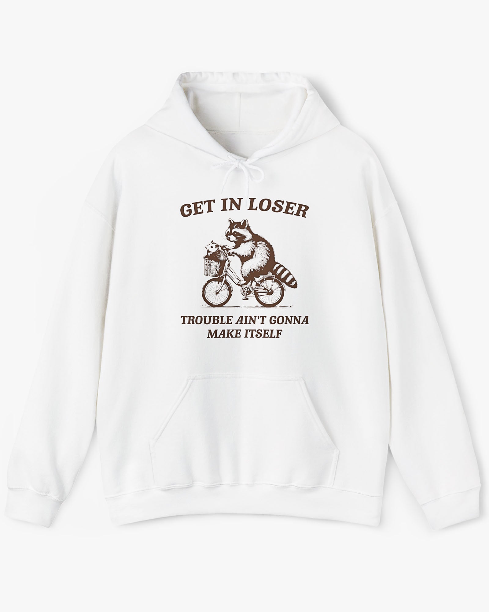 Flat lay white color hoodie with the quote 'Get In Loser, Trouble Ain't Gonna Make Itself' and a funny retro raccoon riding a bycicle graphic