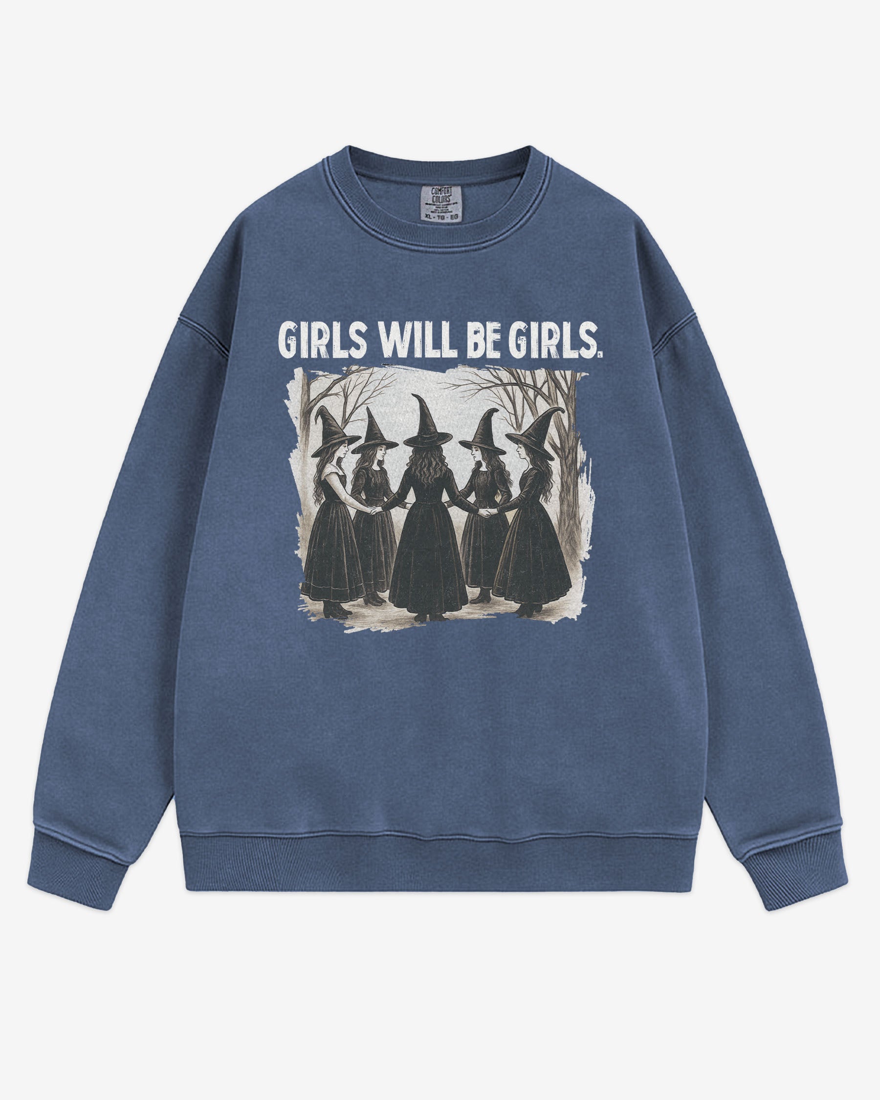 Flat lay denim 'Girls Will Be Girls' sweatshirt with retro graphic of witches holding hands in a Halloween ritual.