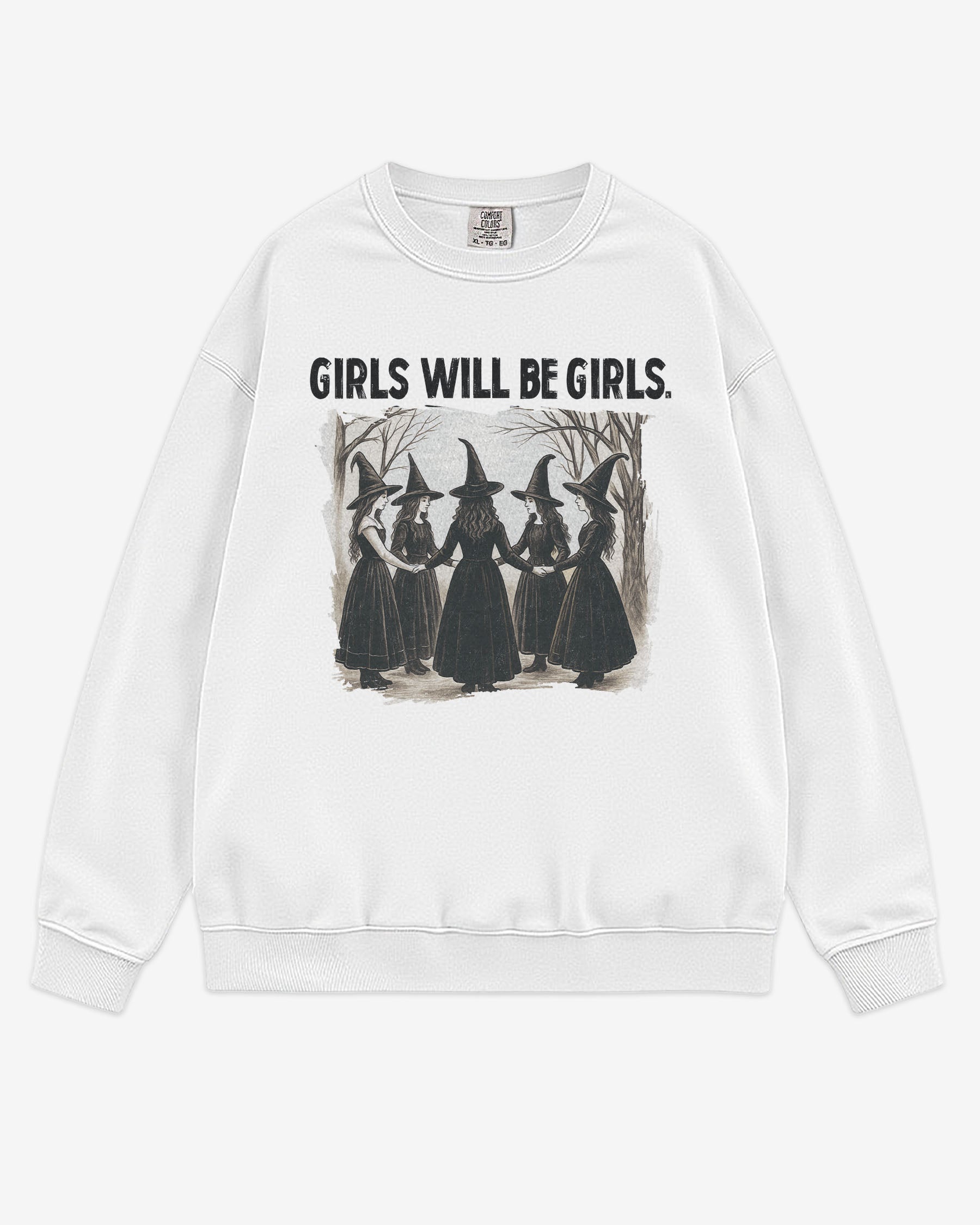 Flat lay white 'Girls Will Be Girls' sweatshirt with retro graphic of witches holding hands in a Halloween ritual.