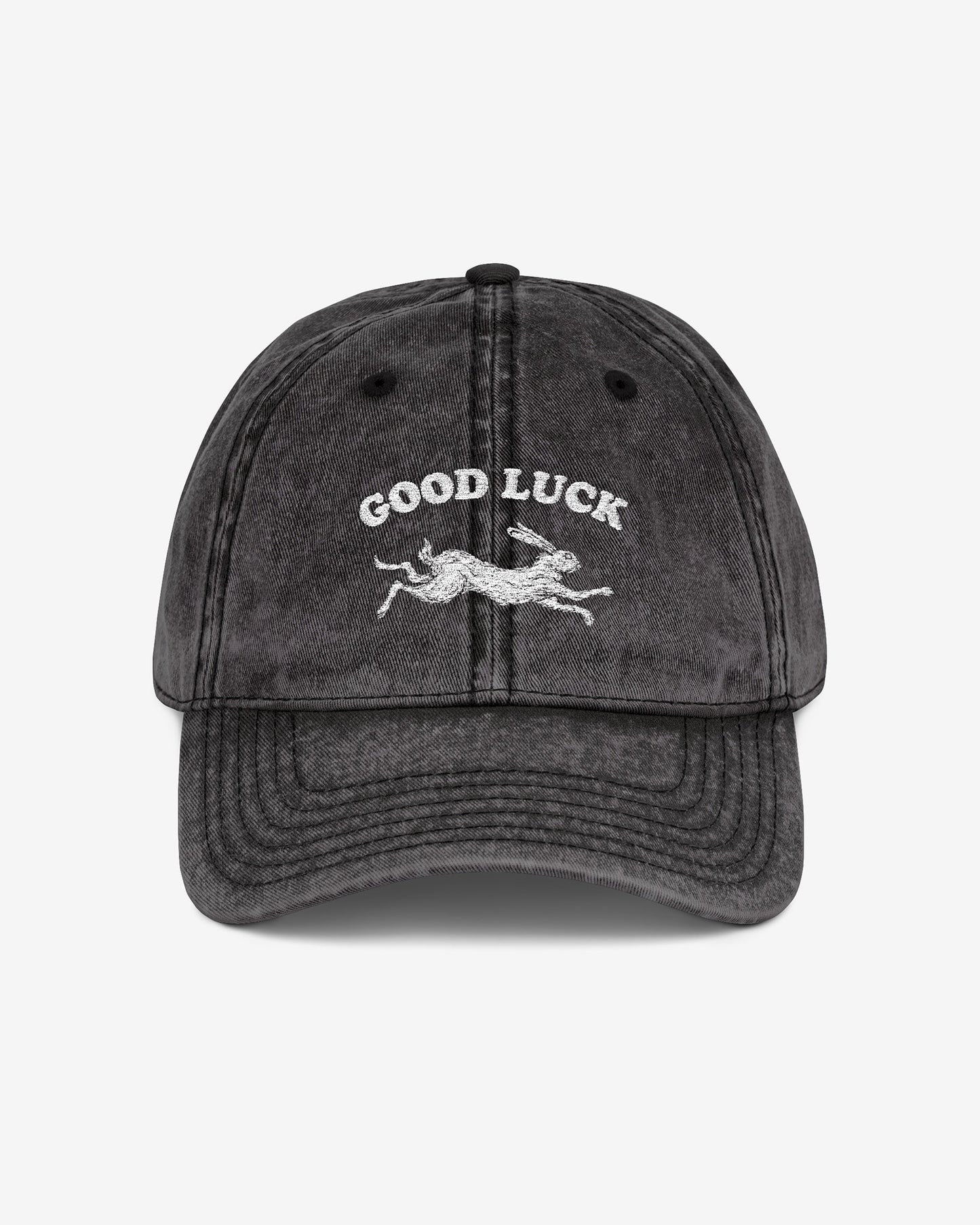 Good Luck embroidered vintage cap in black with retro graphic of running rabbit