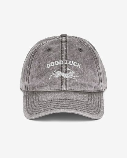 Good Luck embroidered vintage cap in charcoal gray with retro graphic of running rabbit