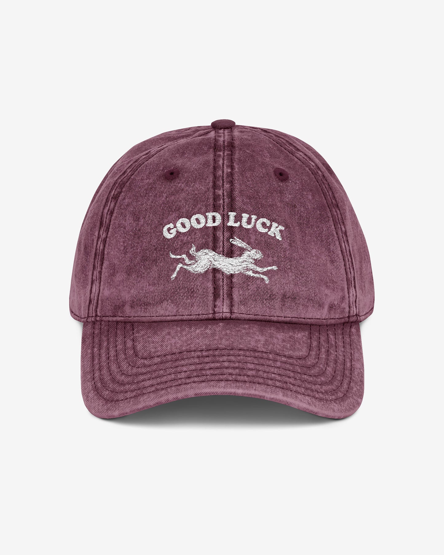 Good Luck embroidered vintage cap in maroon with retro graphic of running rabbit