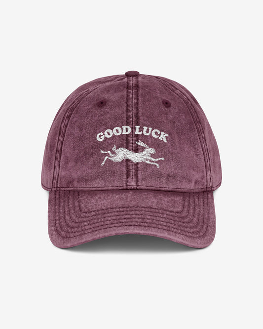 Good Luck embroidered vintage cap in maroon with retro graphic of running rabbit