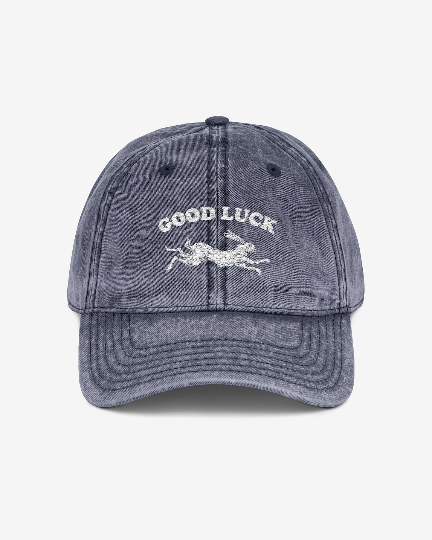 Good Luck embroidered vintage cap in navy with retro graphic of running rabbit