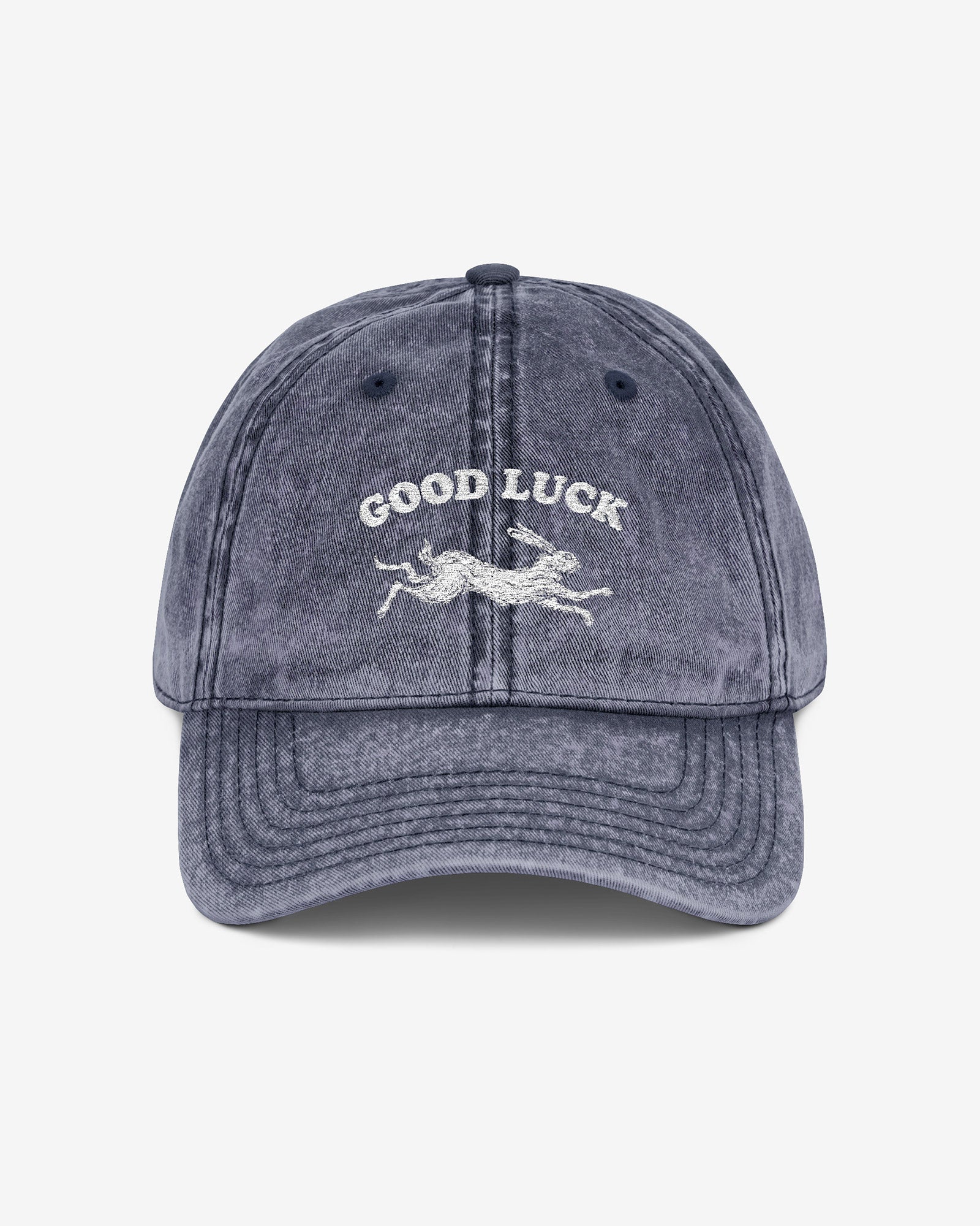Good Luck embroidered vintage cap in navy with retro graphic of running rabbit