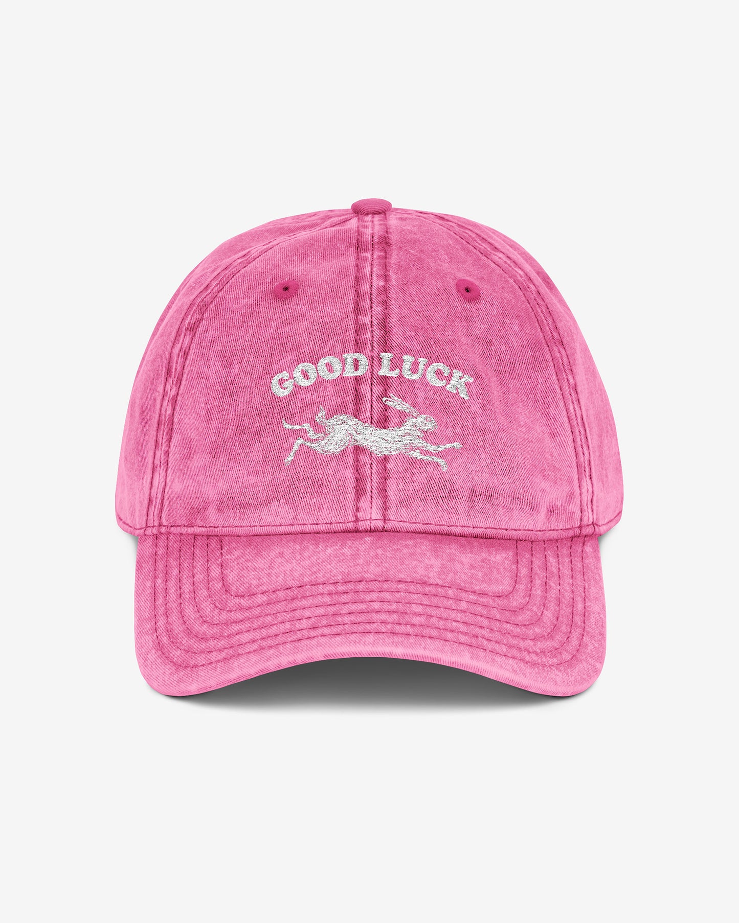 Good Luck embroidered vintage cap in pink with retro graphic of running rabbit