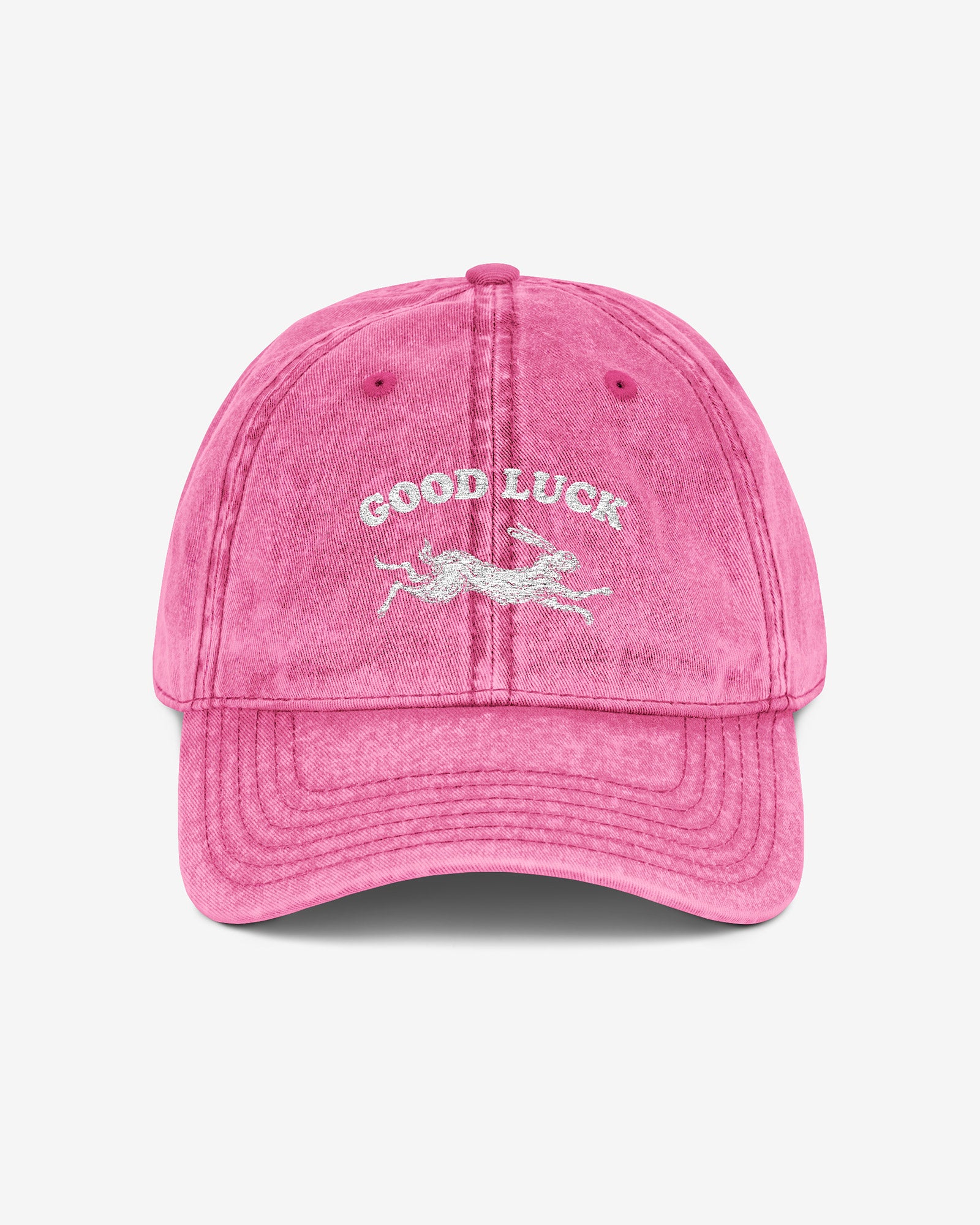 Good Luck embroidered vintage cap in pink with retro graphic of running rabbit