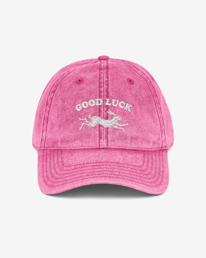 Good Luck embroidered vintage cap in pink with retro graphic of running rabbit