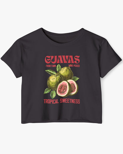 Flat lay of a black crop top with a retro commercial guavas fruit graphic.