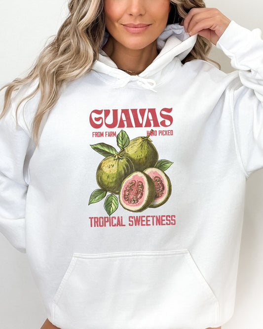 Woman wearing a white vintage-style Guavas Fruit Hoodie featuring a retro guava label graphic on a soft, cozy unisex hoodie.
