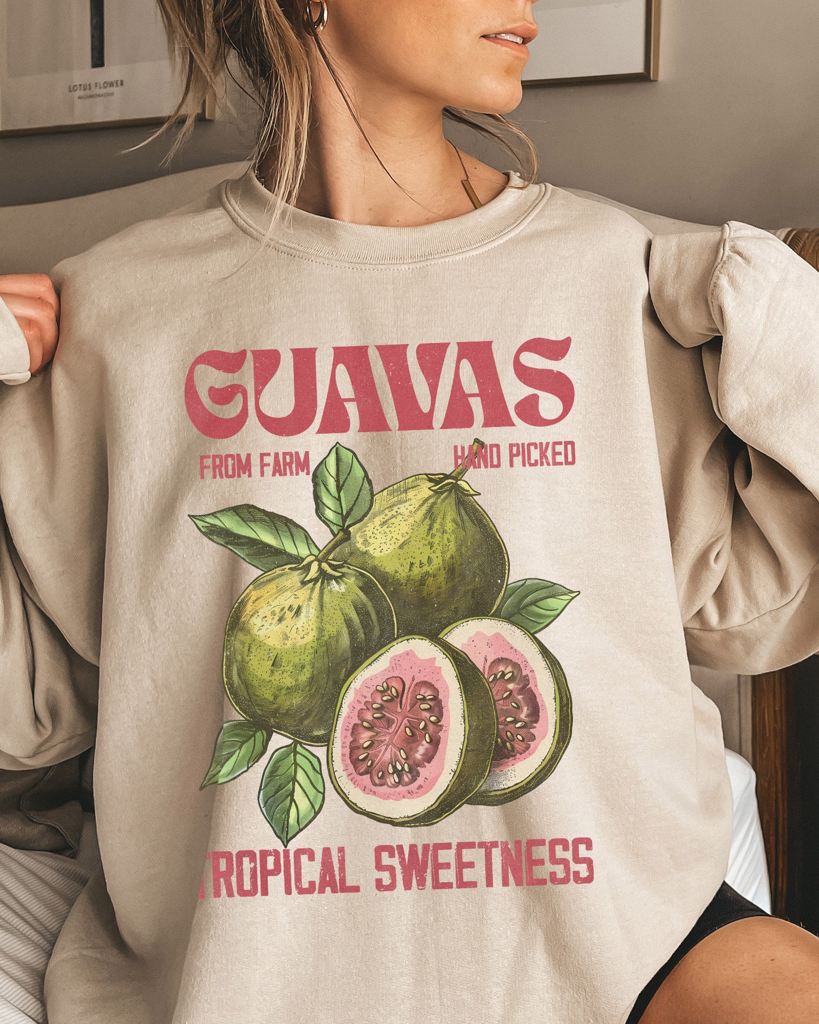 Woman wearing Guavas Fruit sweatshirt in sand color