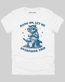 White flat lay 'Hang On Let me Overthink This' shirt with funny retro raccoon wearing sunglasses graphic.