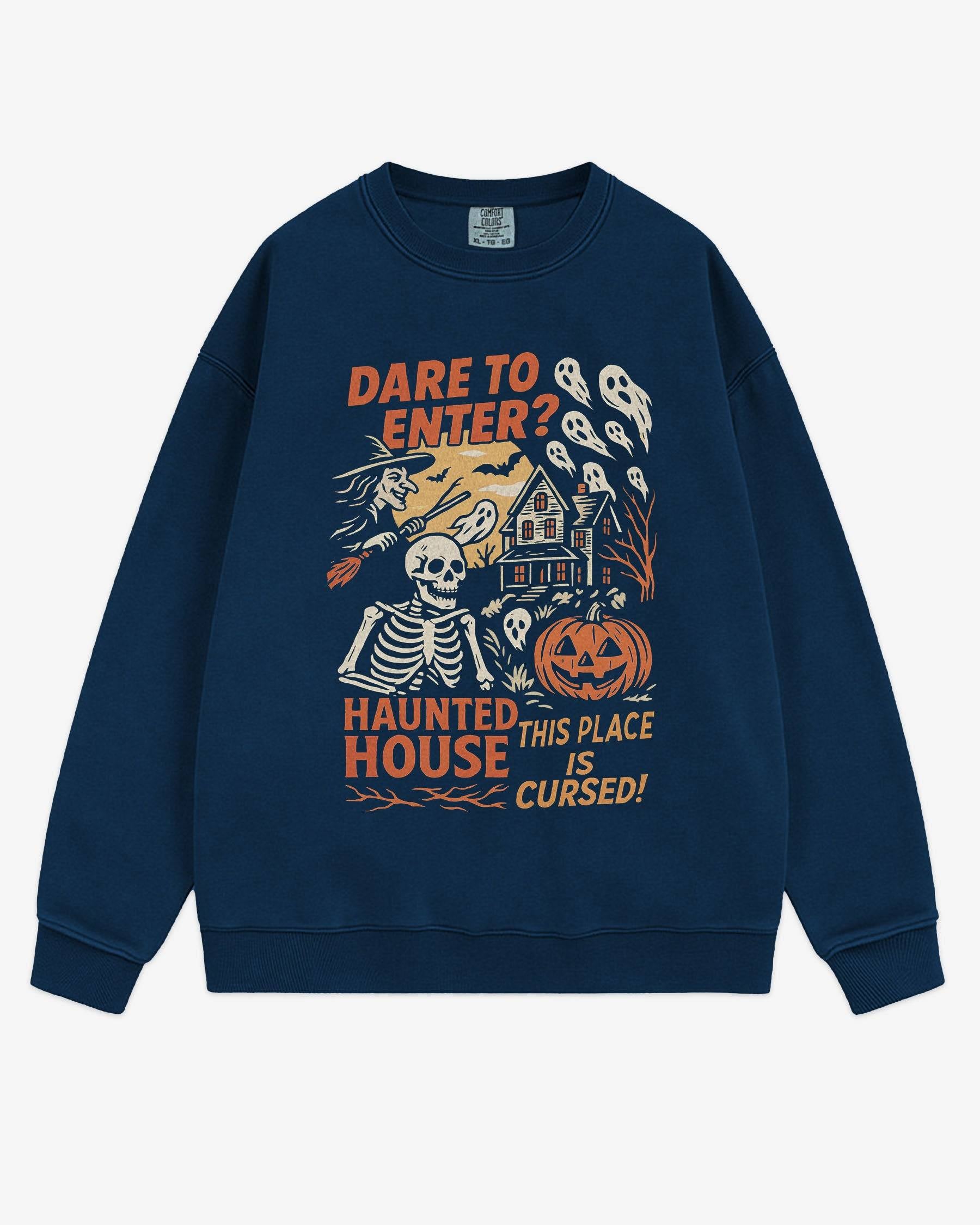 Flat lay true navy Halloween sweatshirt reading ‘Dare To Enter – Haunted House’ with retro graphic of haunted house, skeletons, and a witch.