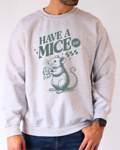 Model wearing ash color sweatshirt with 'Have A Mice Day' graphic design