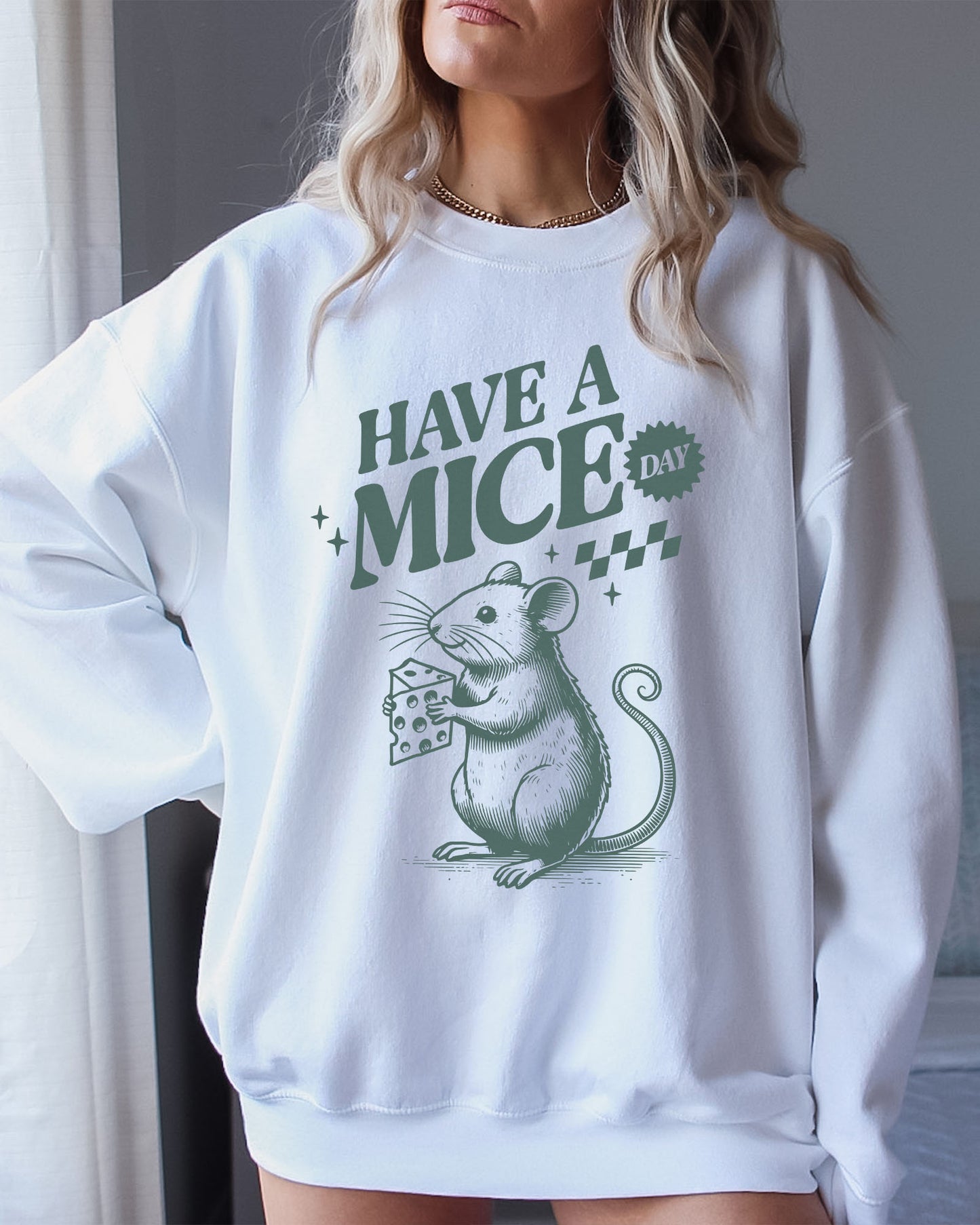Model wearing white color sweatshirt with 'Have A Mice Day' graphic design