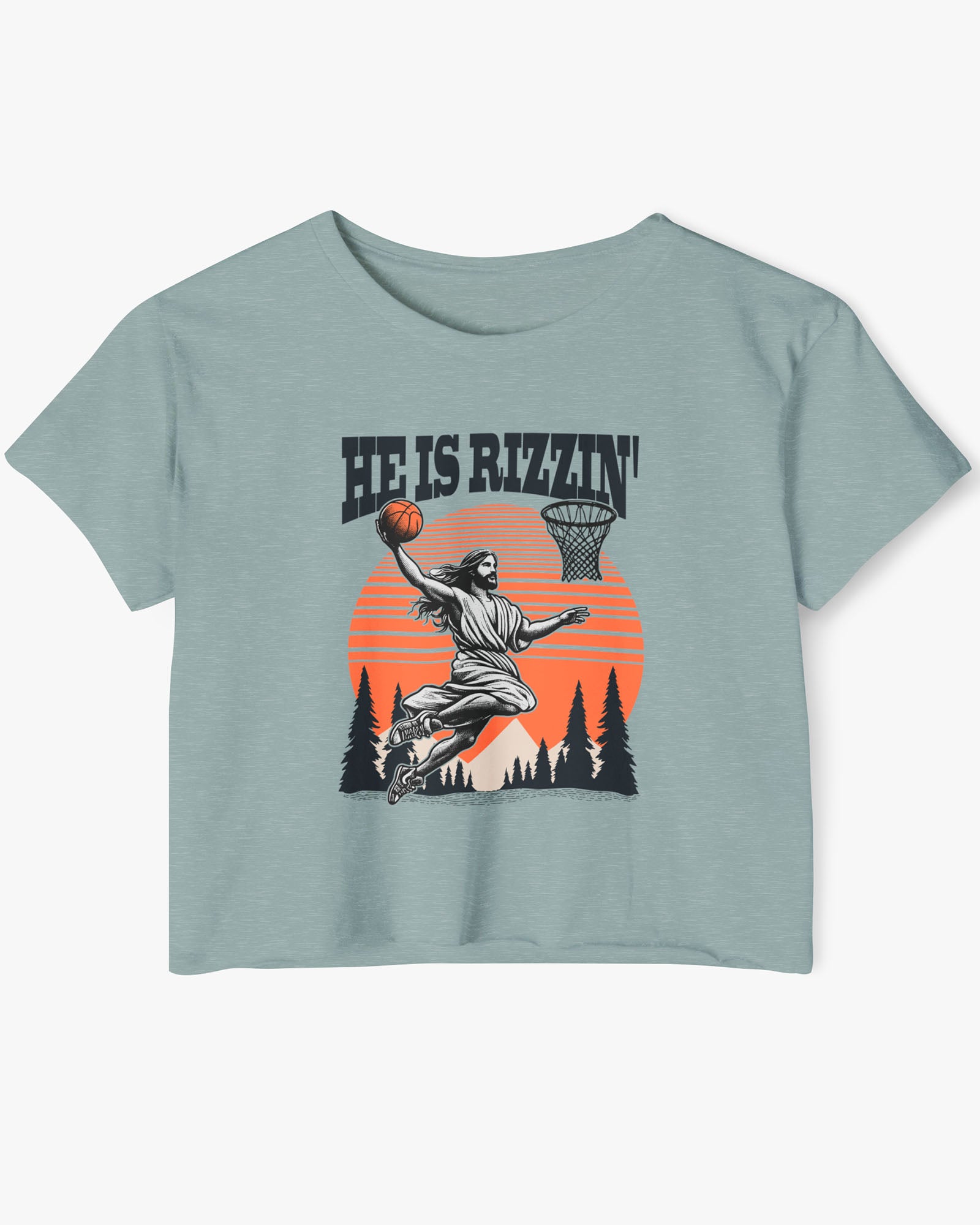 Flat lay of a stonewash green 'He Is Rizzin' crop top featuring a funny retro graphic of Jesus slam-dunking a basketball.