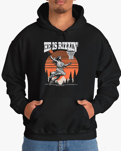 Man wearing black 'He Is Rizzin' hoodie featuring retro Jesus dunking basketball graphic, ideal for Easter.