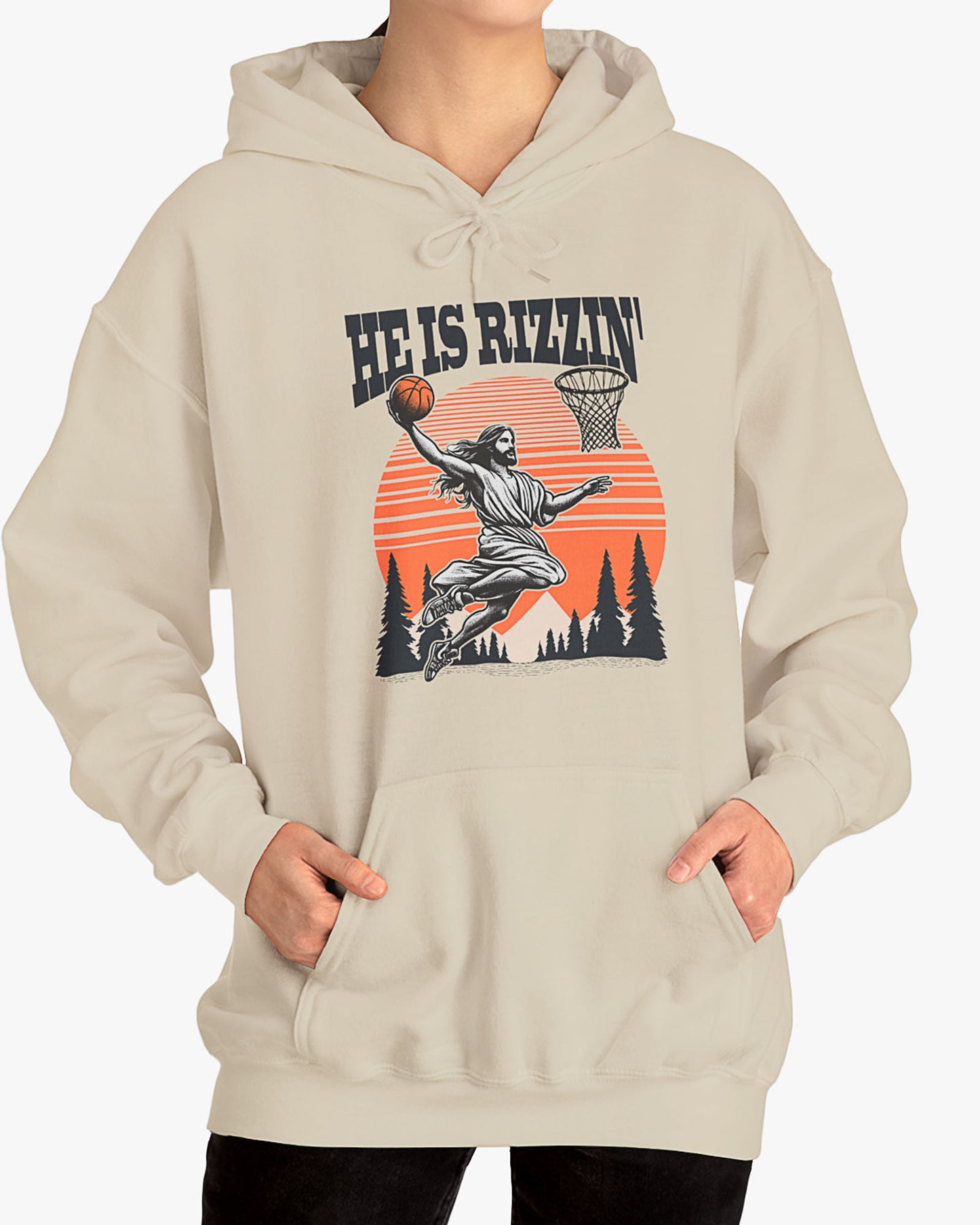 Woman wearing sand beige 'He Is Rizzin' hoodie featuring retro Jesus dunking basketball graphic, ideal for Easter.