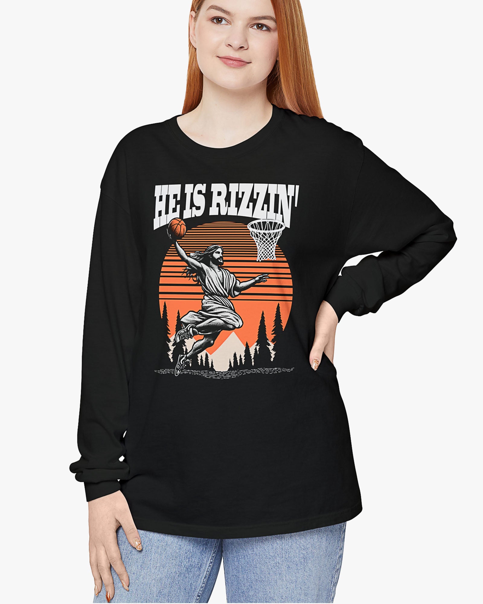 Woman wearing black 'He Is Rizzin' long sleeve tee with funny Jesus playing Basketball graphic