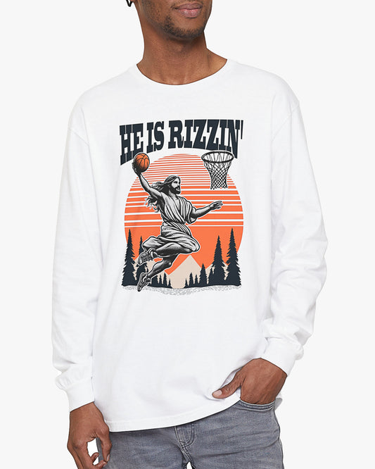 Man wearing white 'He Is Rizzin' long sleeve tee with funny Jesus playing Basketball graphic