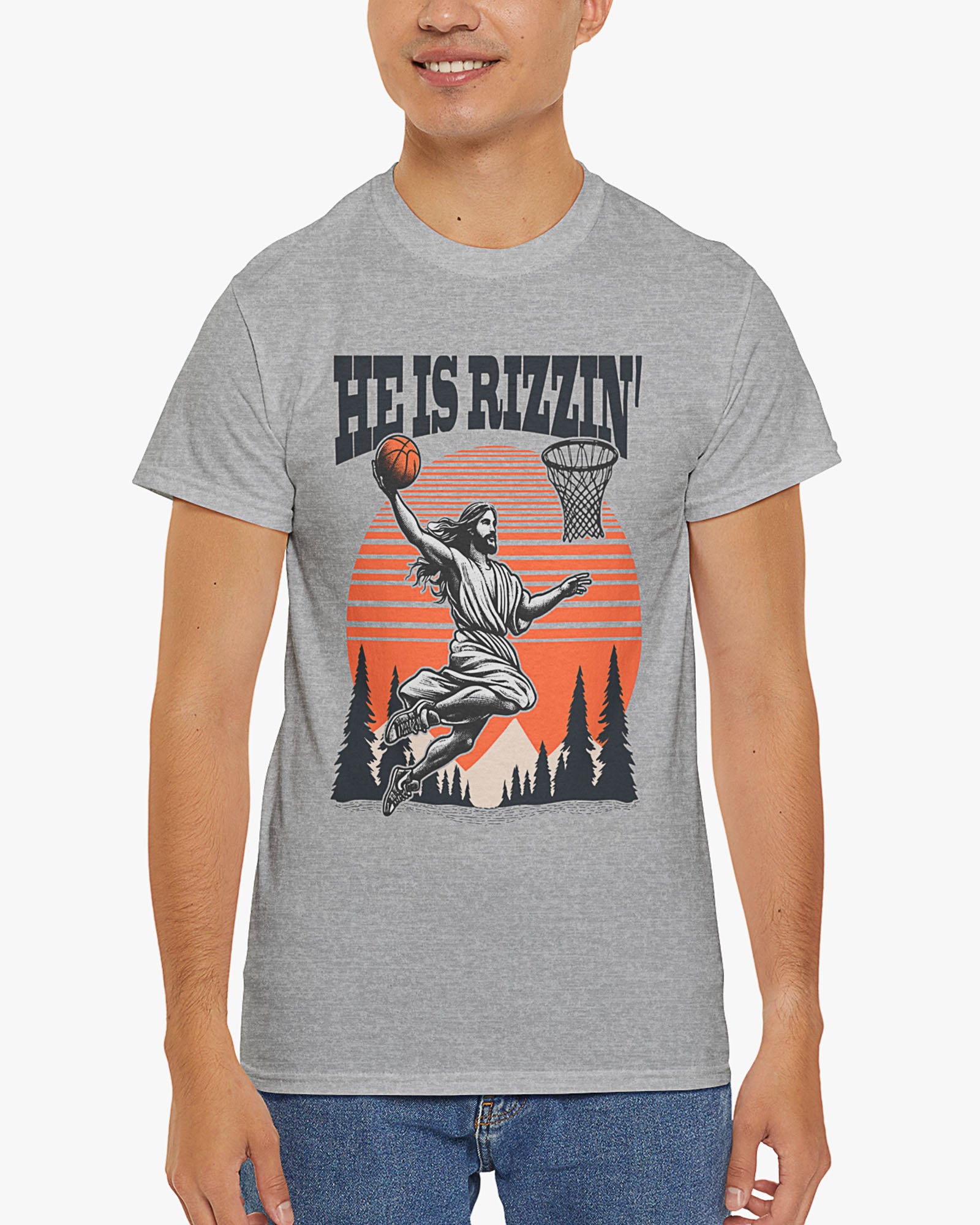 Man wearing 'He Is Rizzin' tee in sport gray color with Jesus playing basketball graphic