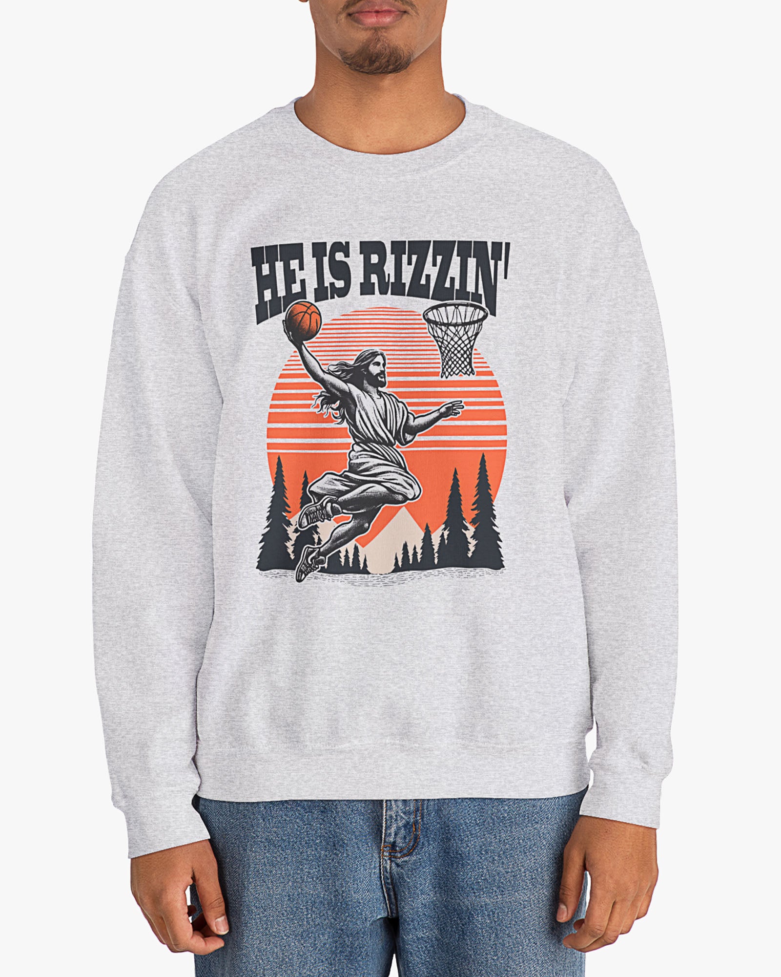Man wearing ash gray 'He Is Rizzin' sweatshirt with retro Jesus dunking basketball graphic, perfect for Easter and funny Y2K style.