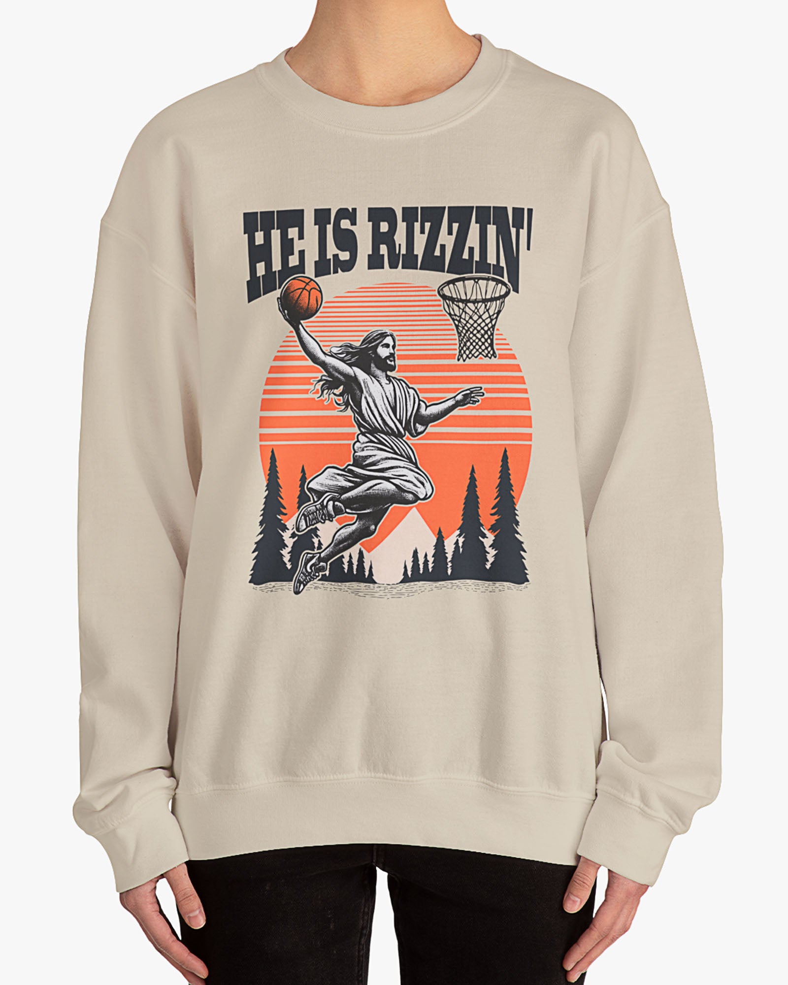 Woman wearing sand beige 'He Is Rizzin' sweatshirt with retro Jesus dunking basketball graphic, perfect for Easter and funny Y2K style.