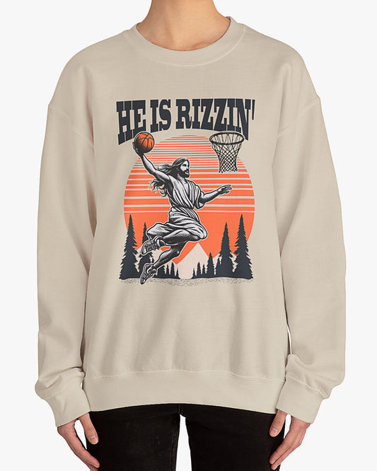 Woman wearing sand beige 'He Is Rizzin' sweatshirt with retro Jesus dunking basketball graphic, perfect for Easter and funny Y2K style.