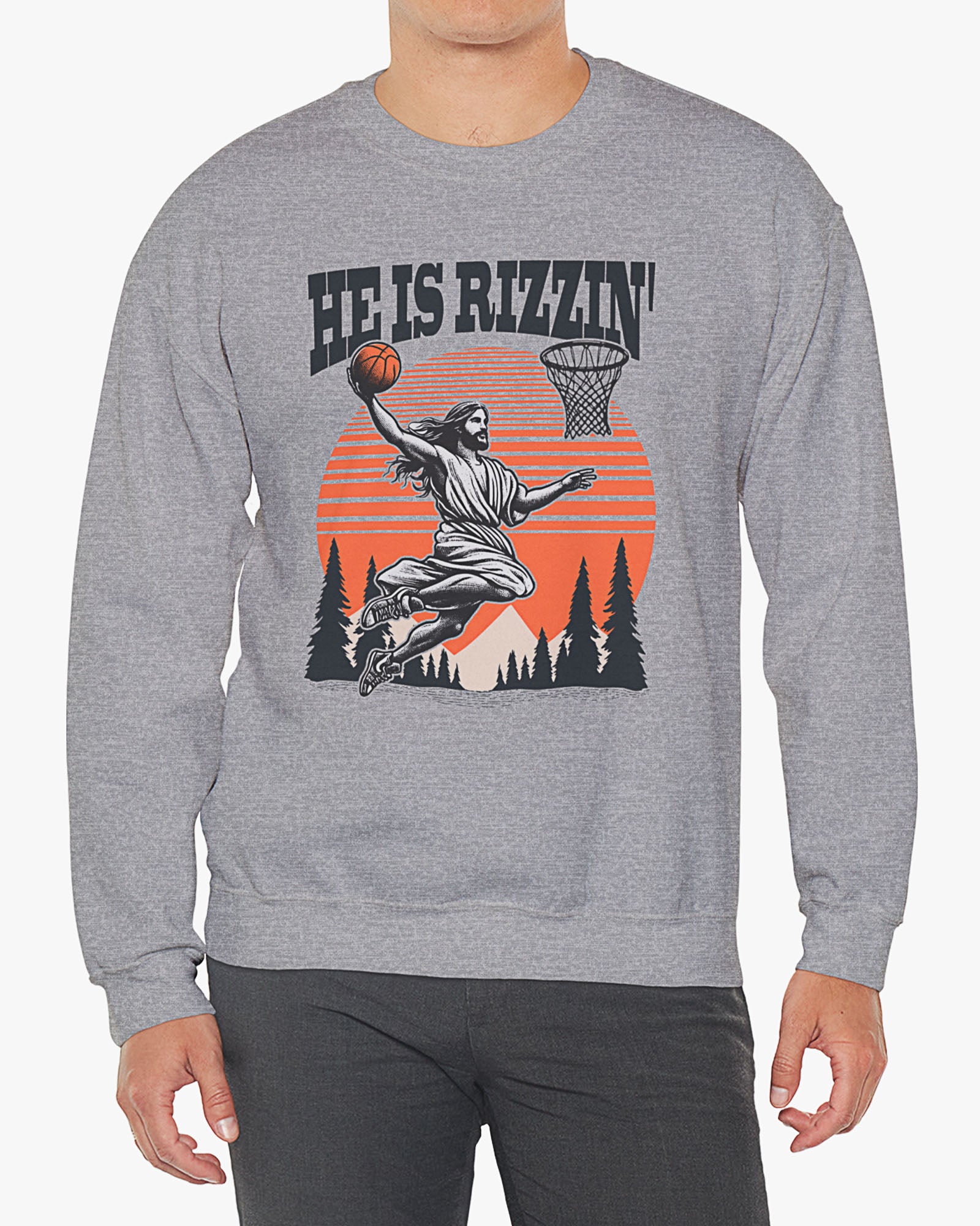 Man wearing sport gray 'He Is Rizzin' sweatshirt with retro Jesus dunking basketball graphic, perfect for Easter and funny Y2K style.