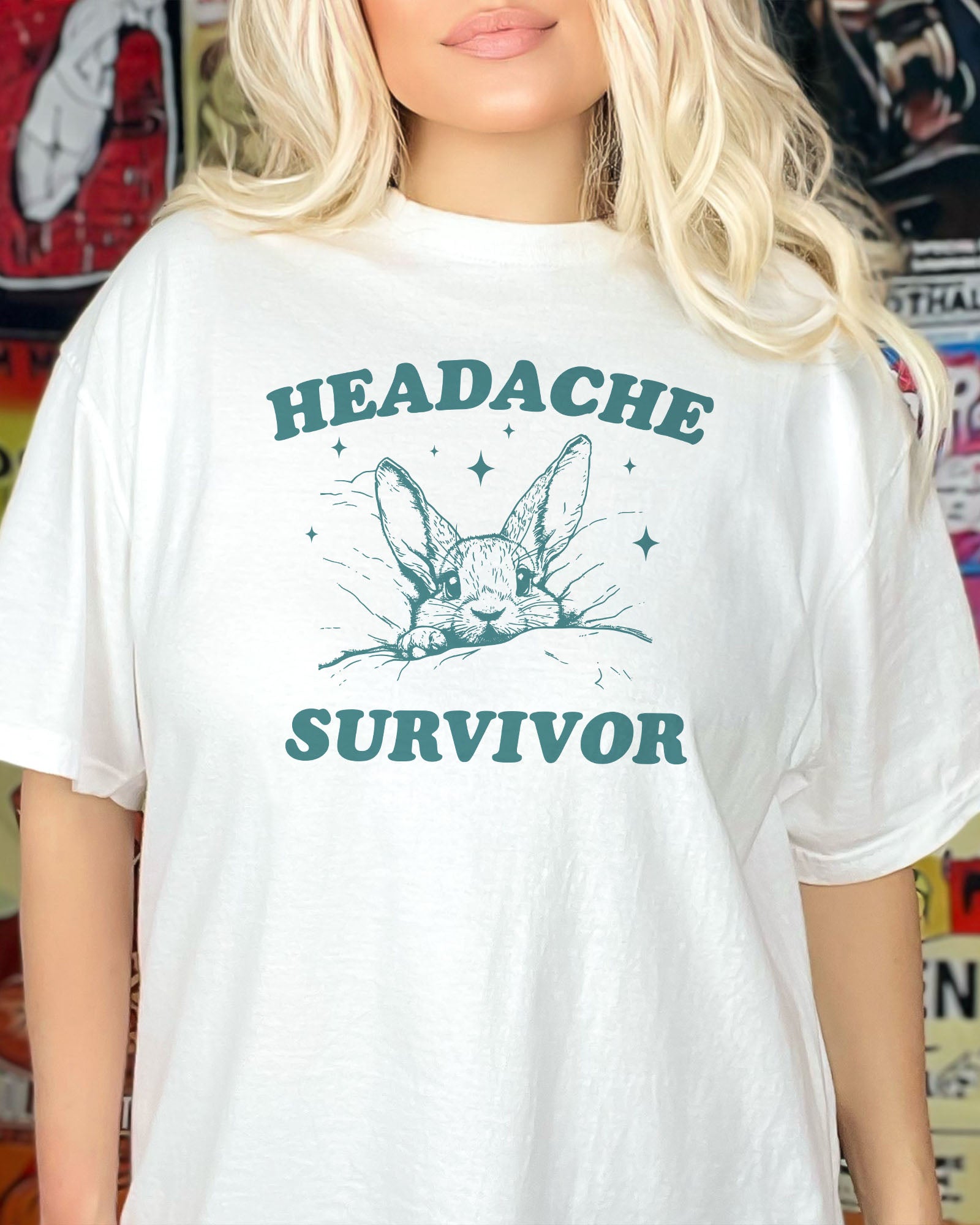 Woman wearing a white 'Headache Survivor' shirt featuring a funny rabbit with a headache graphic.